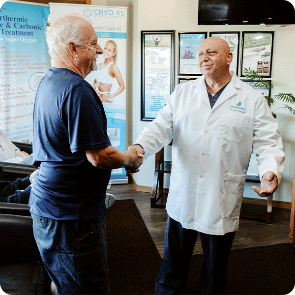 Doctor Tony greets male patient in the waiting room
