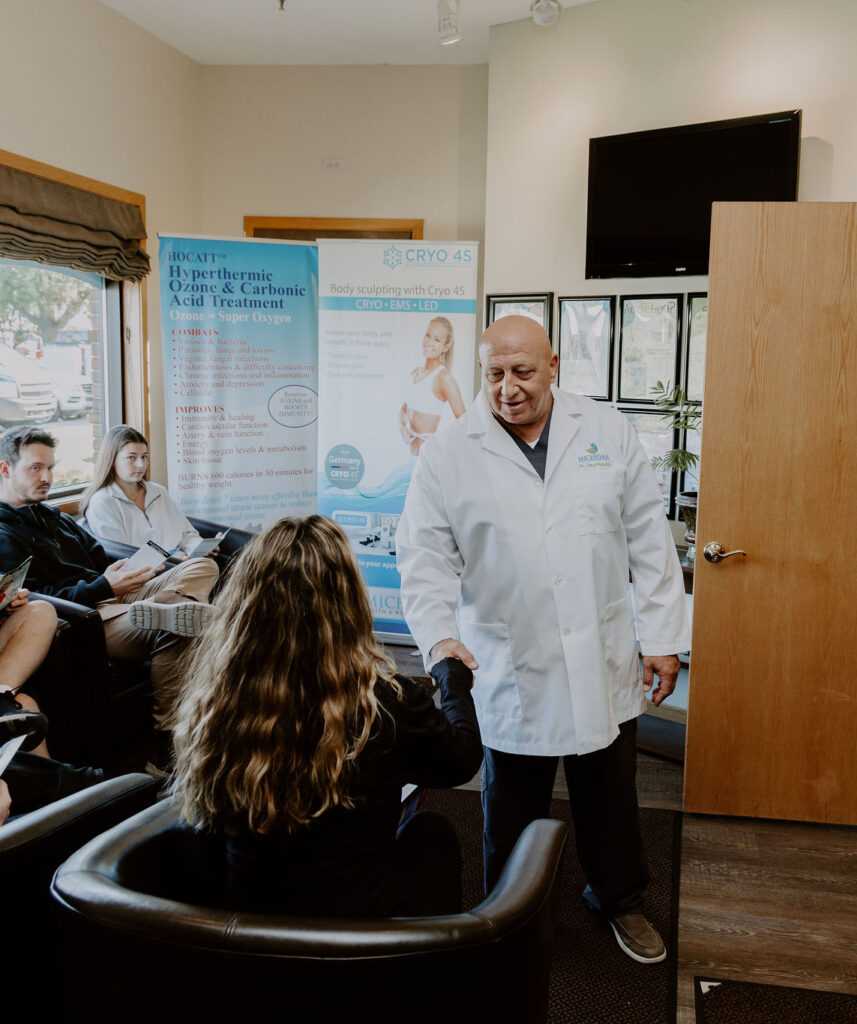 Woman shaking hands with Dr. Tony