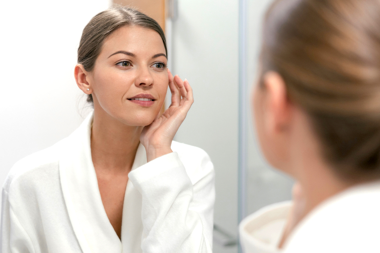 Women looking in the mirror.